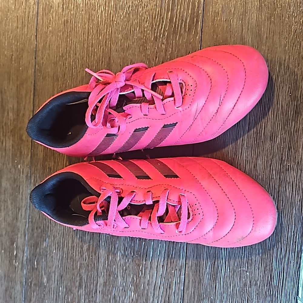 Pink Adidas soccer cleats